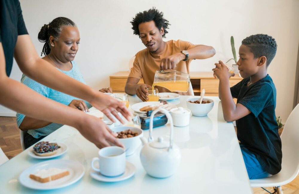 Family having breakfast together at home.