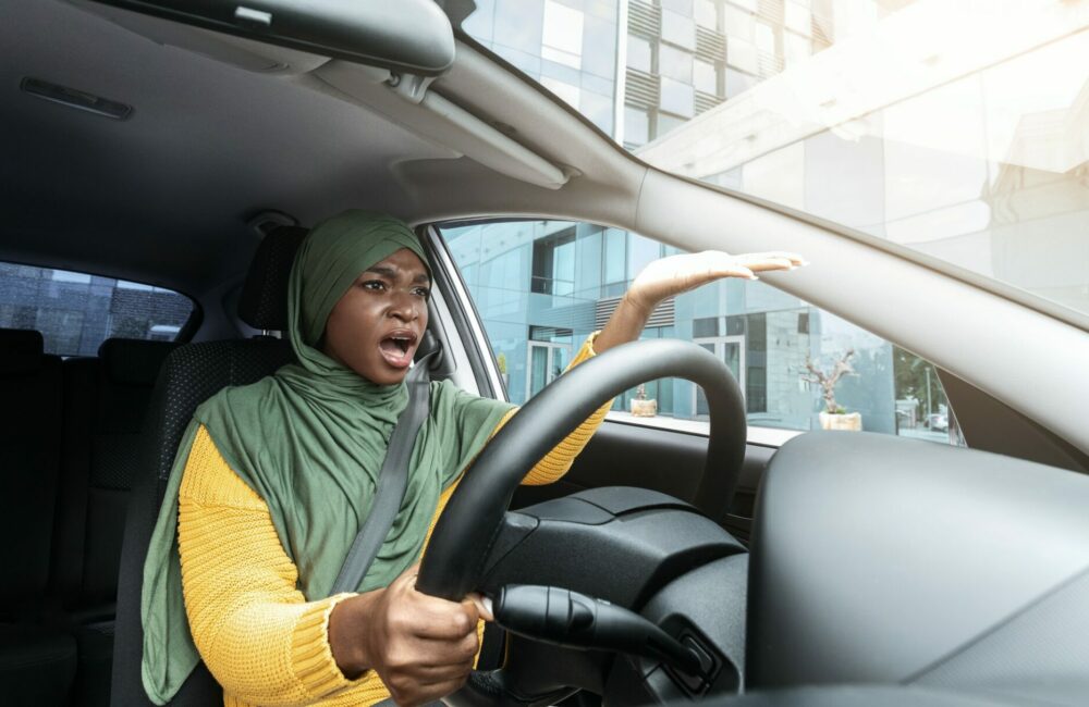 Trafic Stress. Annoyed Black Muslim Woman Complaining About Something While Driving Car